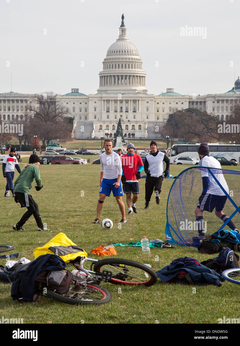 Washington, DC - Men play an informal soccer game on the National Mall near the U.S. Capitol. Stock Photo