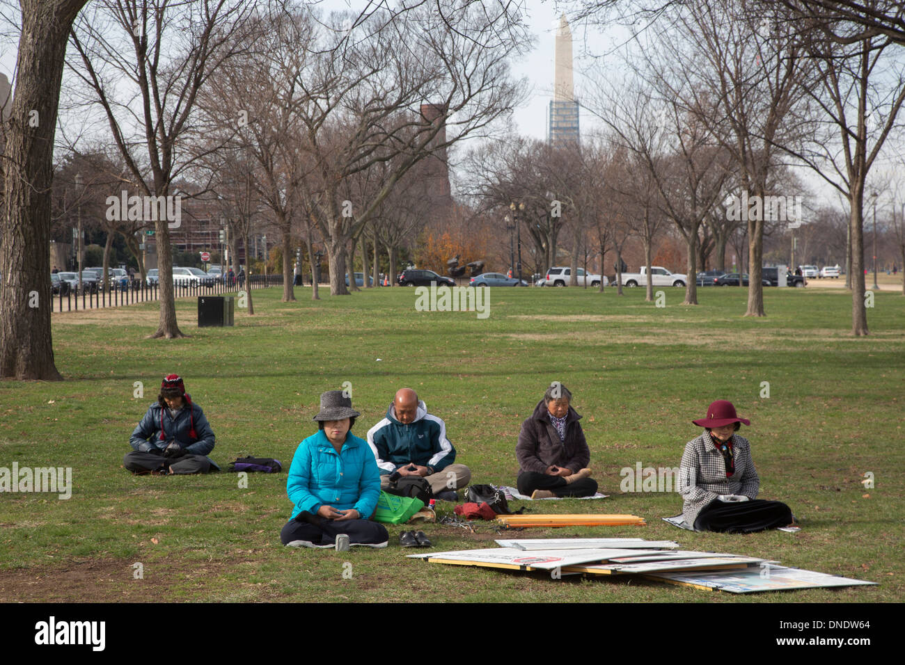 Washington, DC - Falun Gong practitioners meditate on the National Mall. Stock Photo