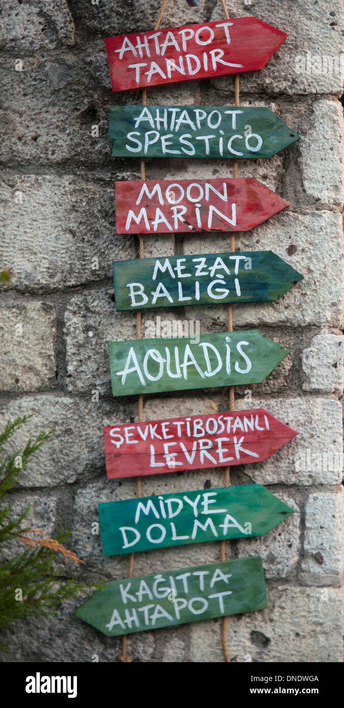 Wooden signs of the menu of a fish restaurant on the wall Stock Photo