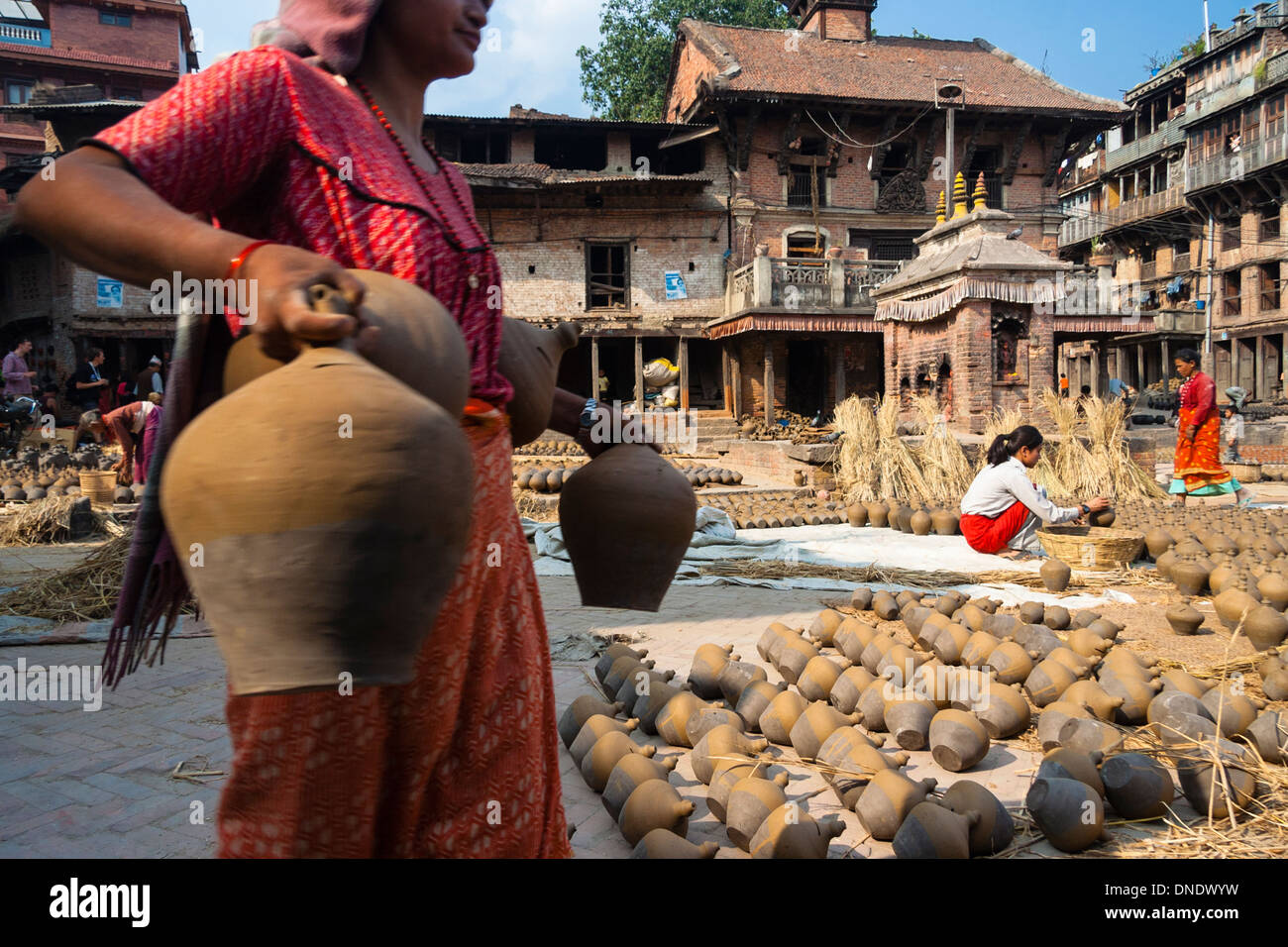 Newari women working at Potters Square in Bhaktapur. Kathmandu Valley, Nepal Stock Photo
