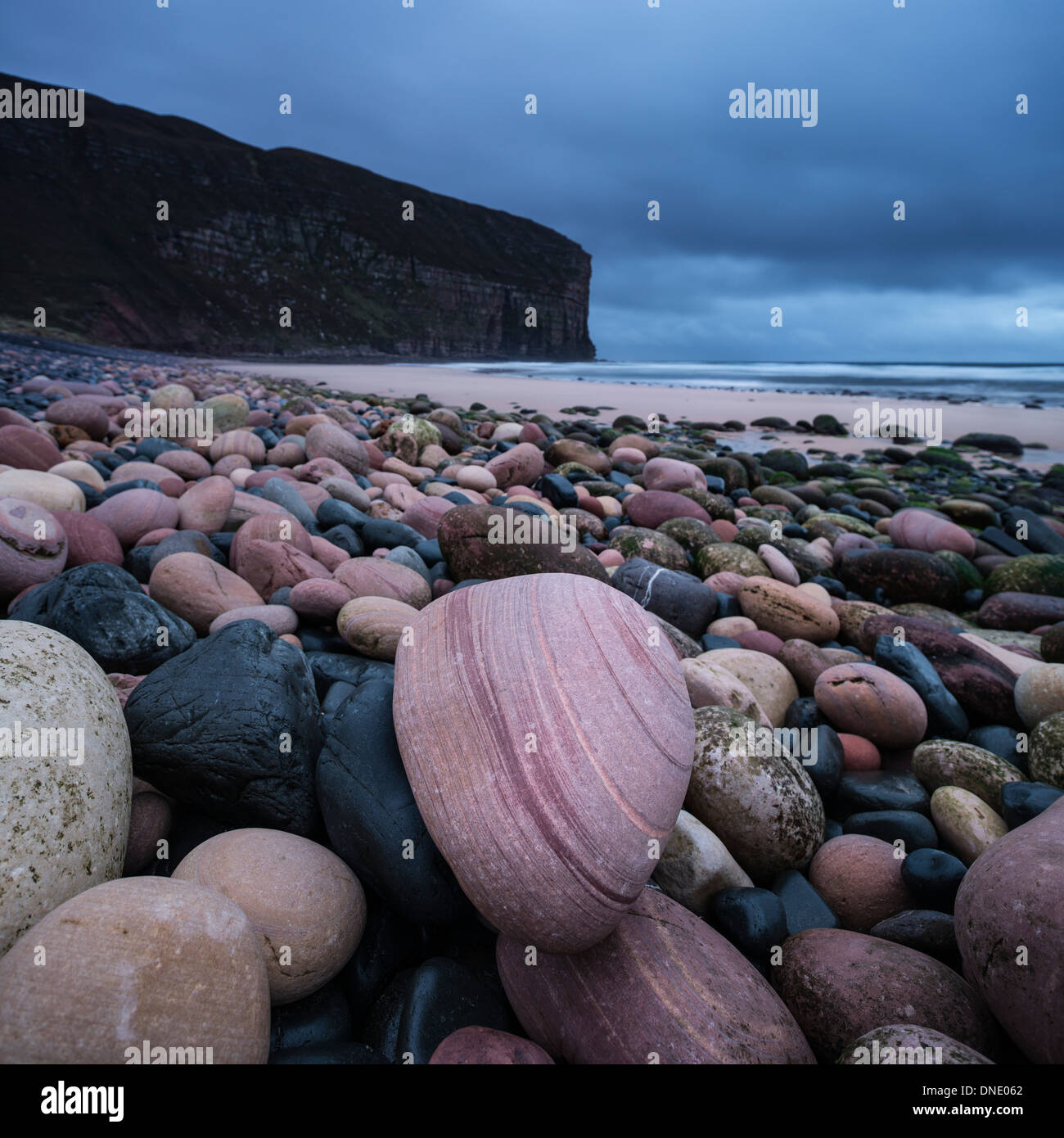 Red sandstone boulders on beach at Rackwick Bay, Hoy, Orkney, Scotland Stock Photo