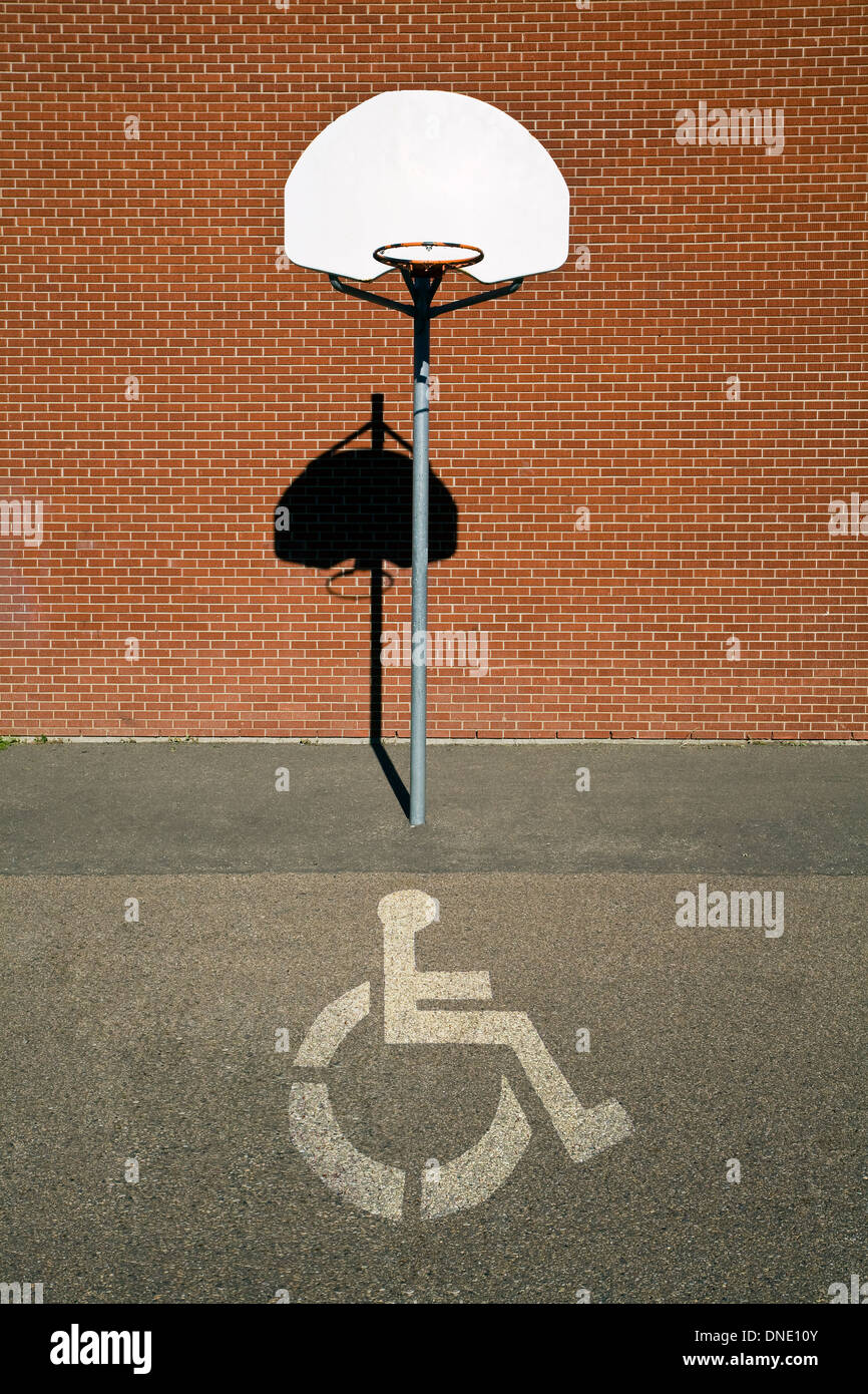 Basketball court with handicap symbol superimposed on court. Stock Photo