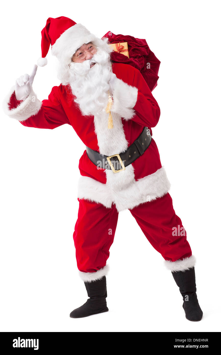Santa Claus carrying sack of gifts Stock Photo - Alamy