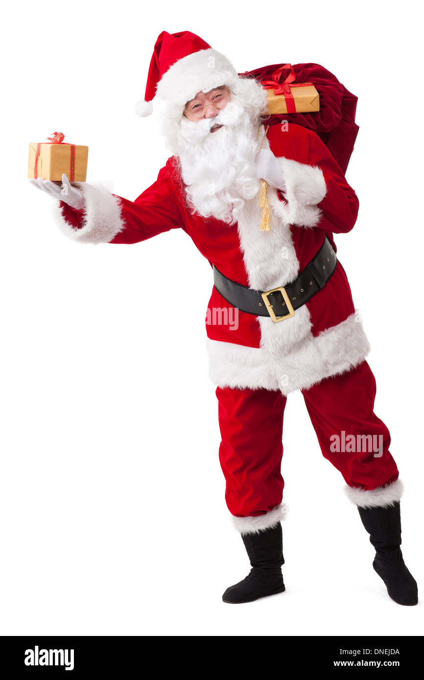 Santa Claus carrying sack of gifts and waving Stock Photo - Alamy