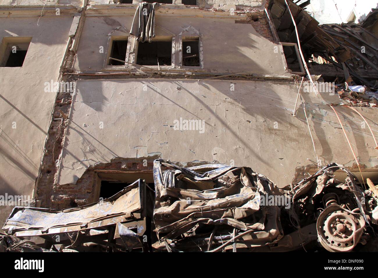 Mansura, Cairo, Egypt. 24th Dec, 2013. Egyptians inspect destruction in