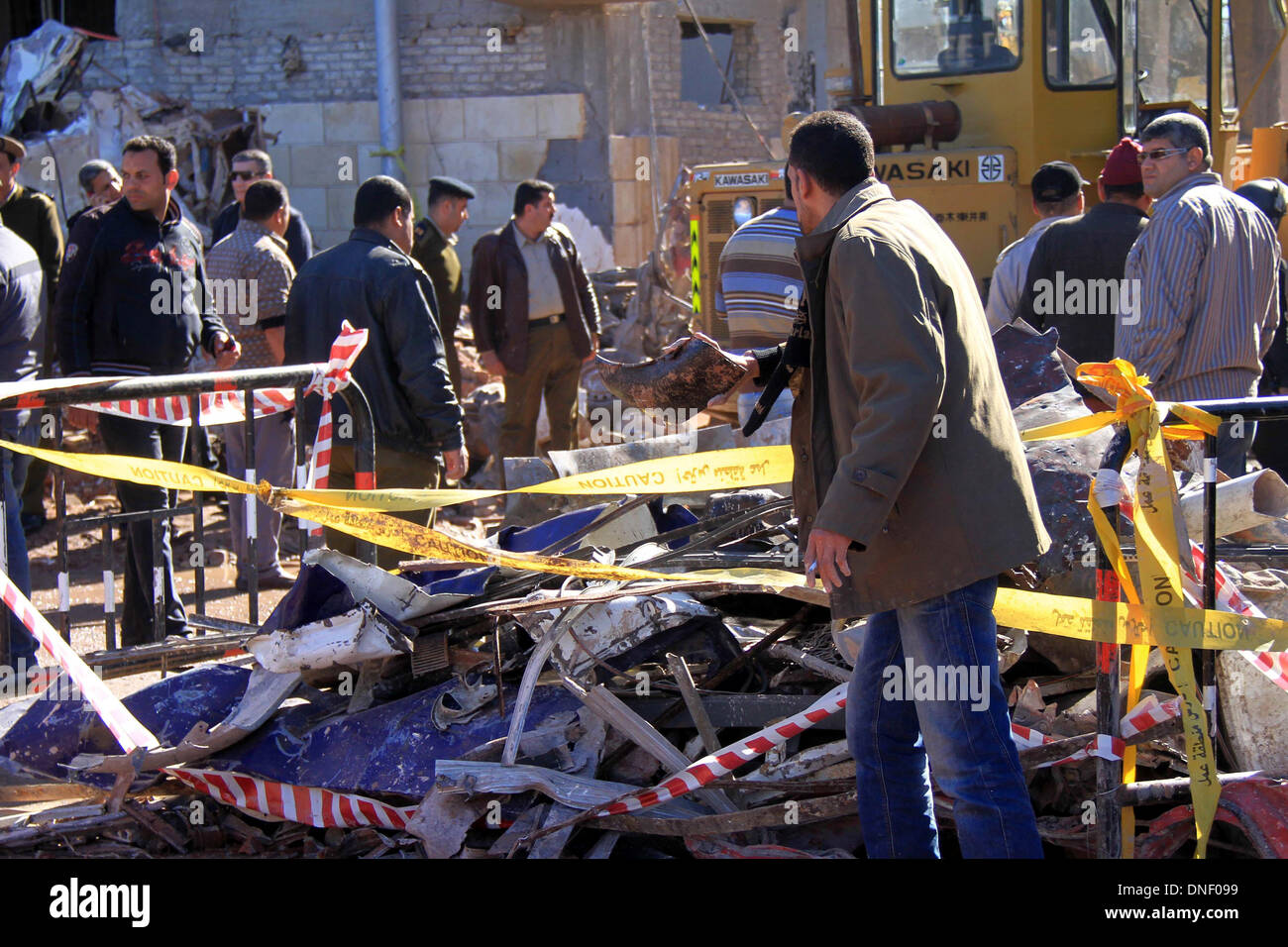 Mansura, Cairo, Egypt. 24th Dec, 2013. Egyptians inspect destruction in