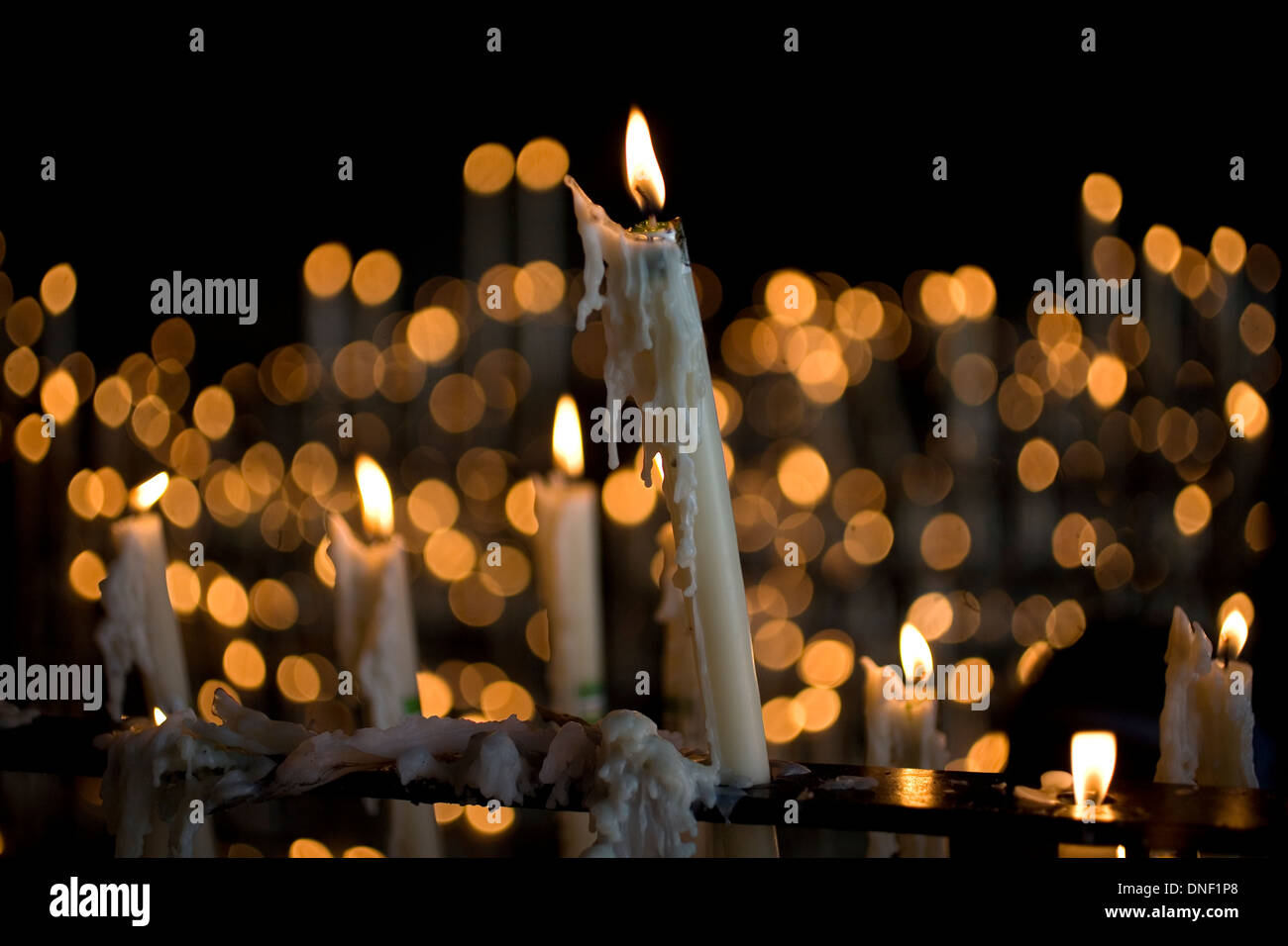 Candles burning in the votive room of the Sanctuary of Our Lady of Rocio, El Rocio village, Almonte, Huelva province, Andalusia, Stock Photo