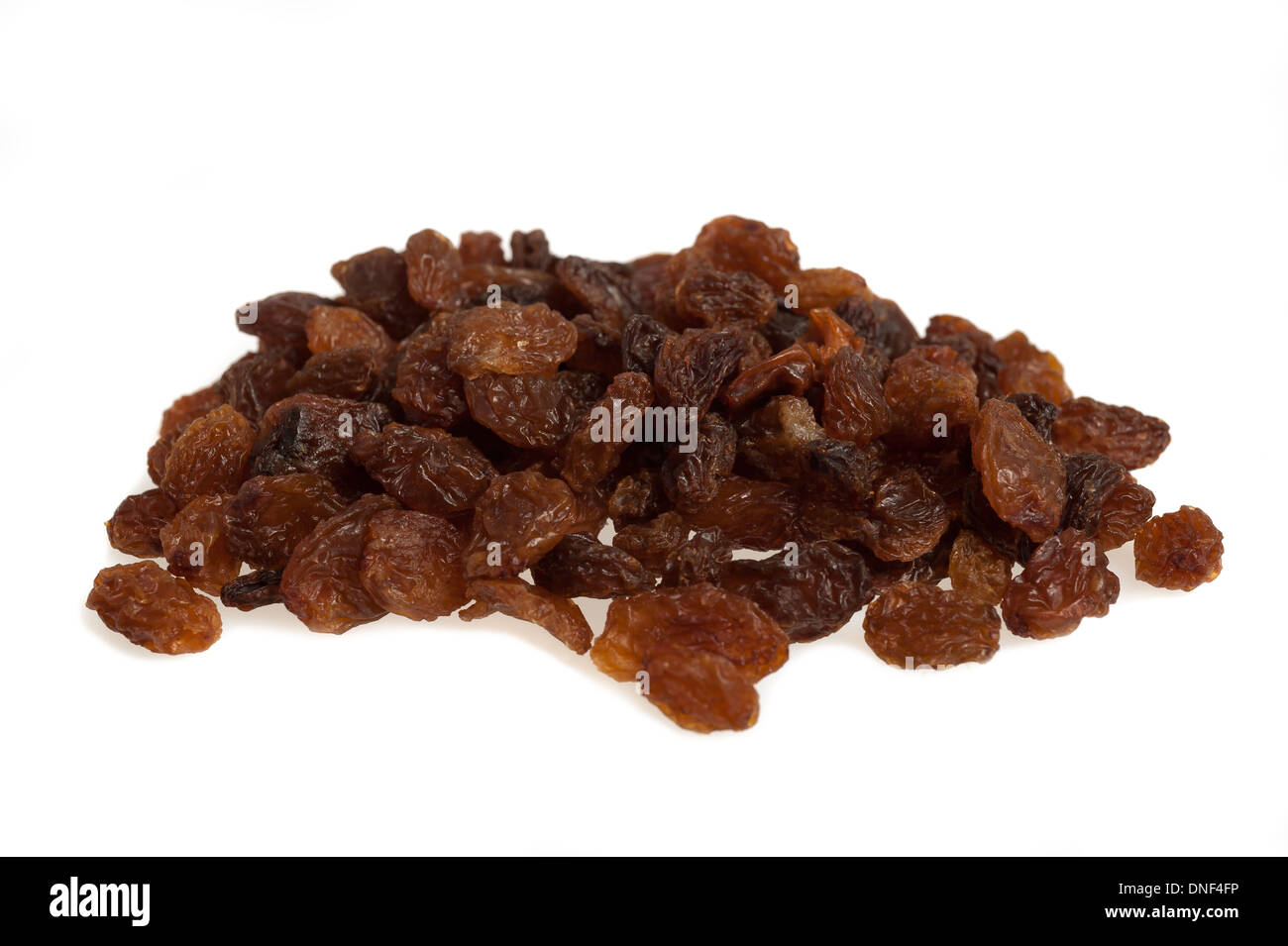 Sultana raisins pile isolated on white Stock Photo - Alamy