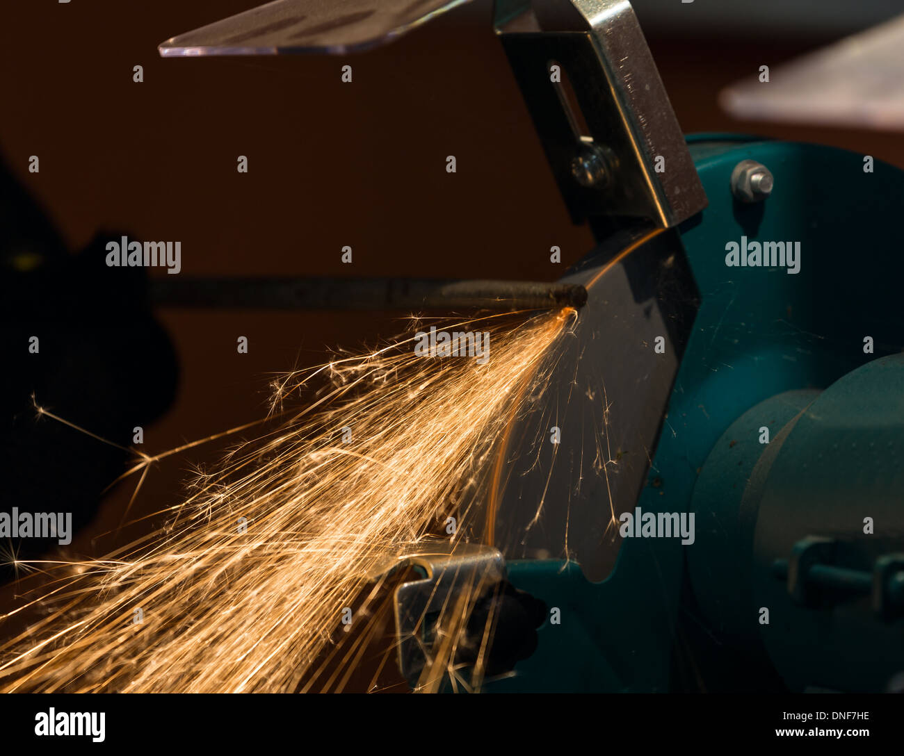 sharpening and cutting of iron by abrasive disk machine Stock Photo - Alamy
