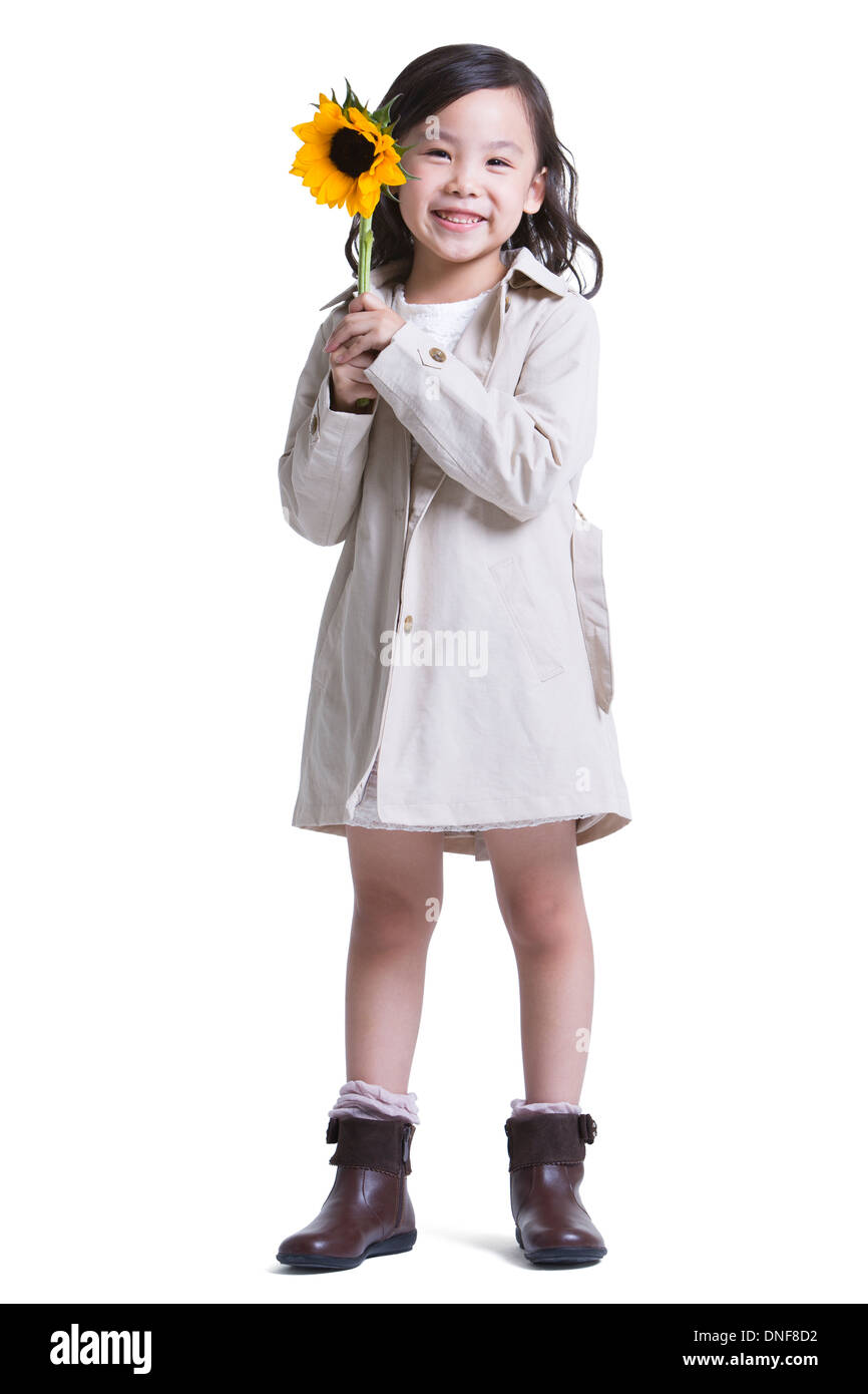 Cute little girl with sunflower Stock Photo - Alamy