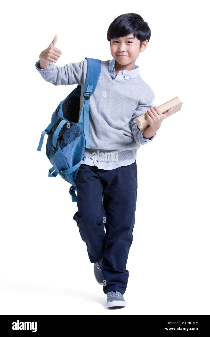 Portrait of cute schoolboy doing thumbs up Stock Photo - Alamy