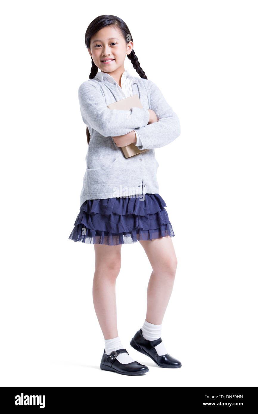 Smiling schoolgirl crossed arms hi-res stock photography and images - Alamy