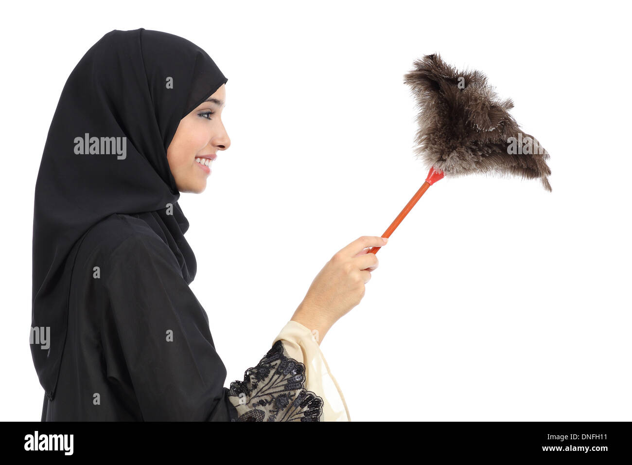 Profile of an arab woman cleaning with a duster clean isolated on a white background Stock Photo
