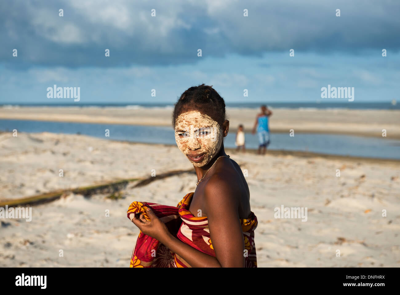 In western Madagascar women use a traditional paste made out of a bark of a tree.This paste is believed to protect the skin Stock Photo