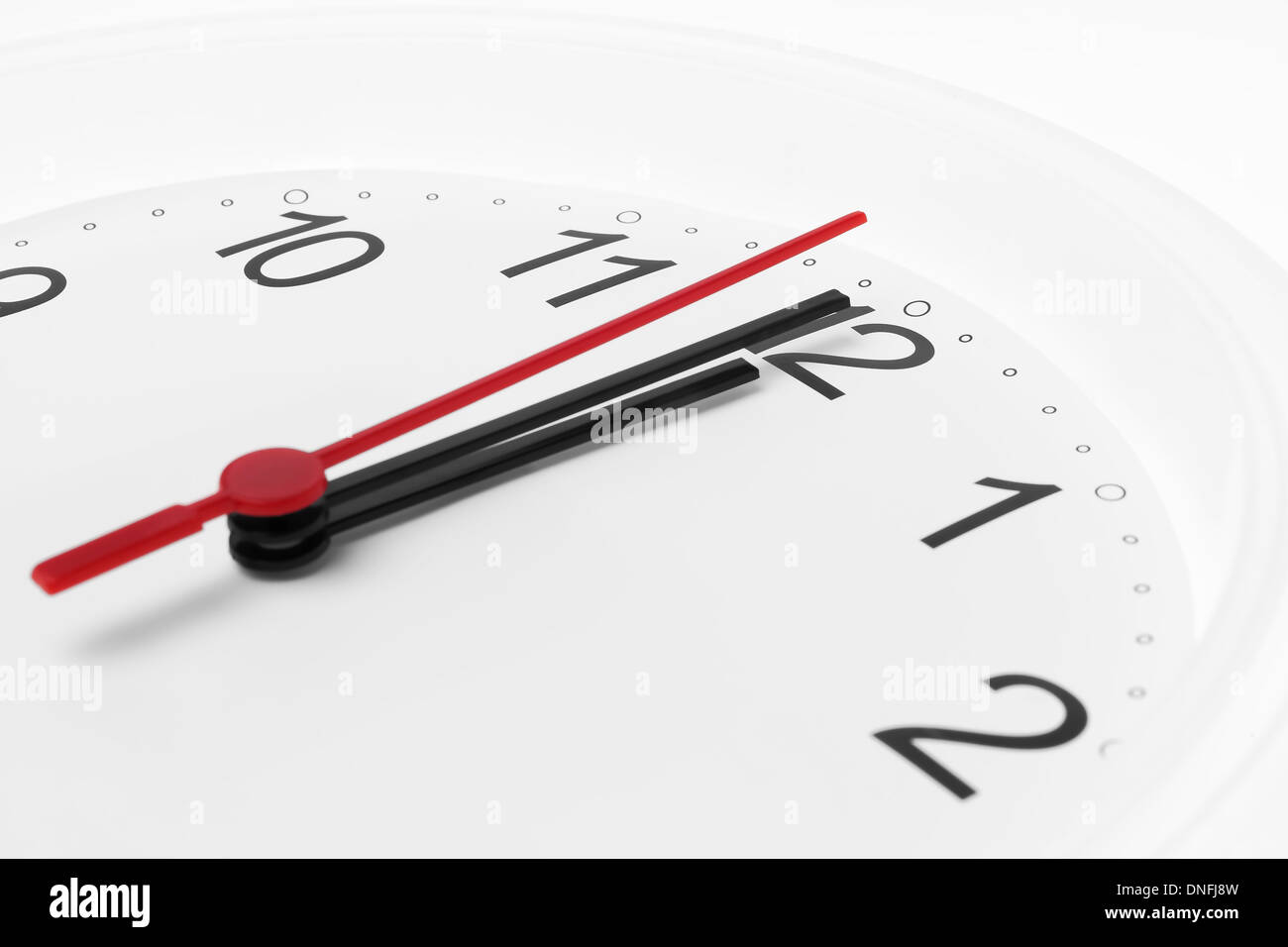 Clock countdown to midnight on white background Stock Photo Alamy