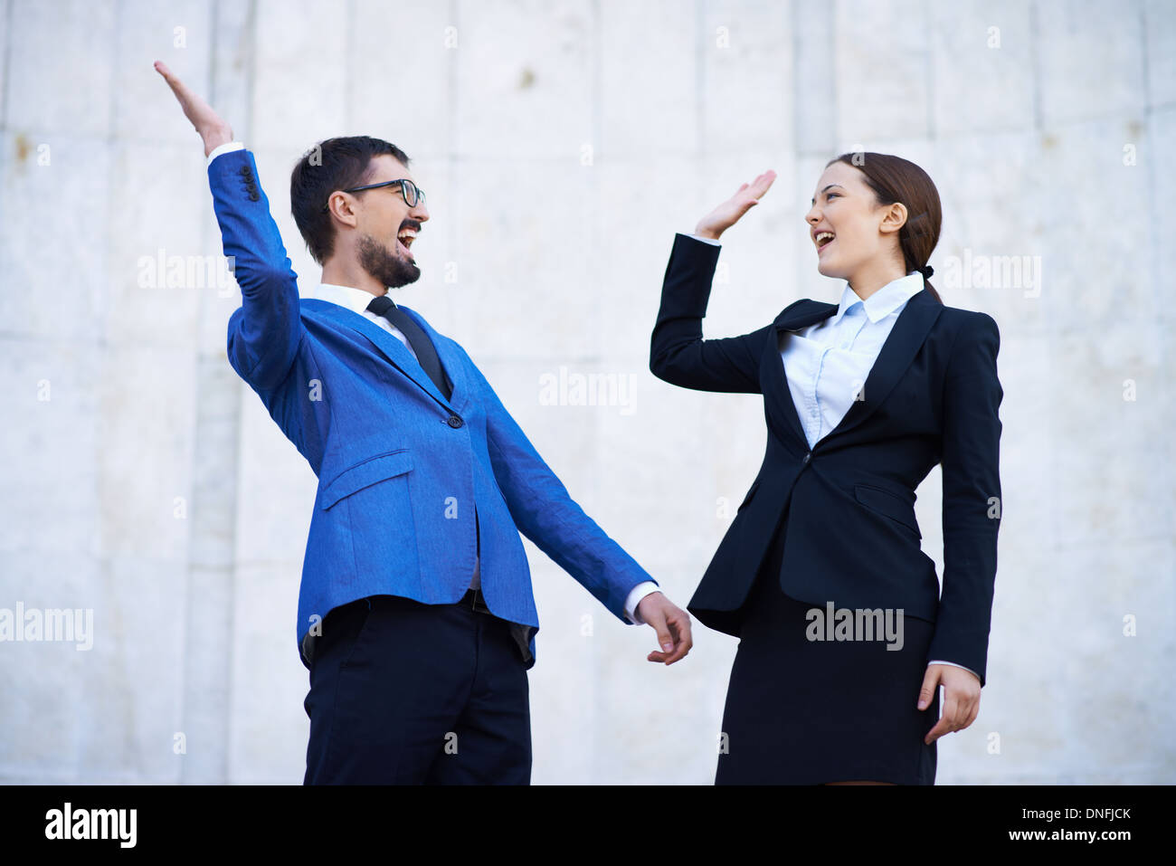 Businessman and his colleague showing their gladness Stock Photo