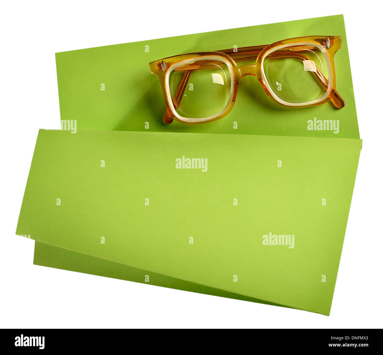 High diopter retro eyeglasses with yellow frame on green creative support Stock Photo