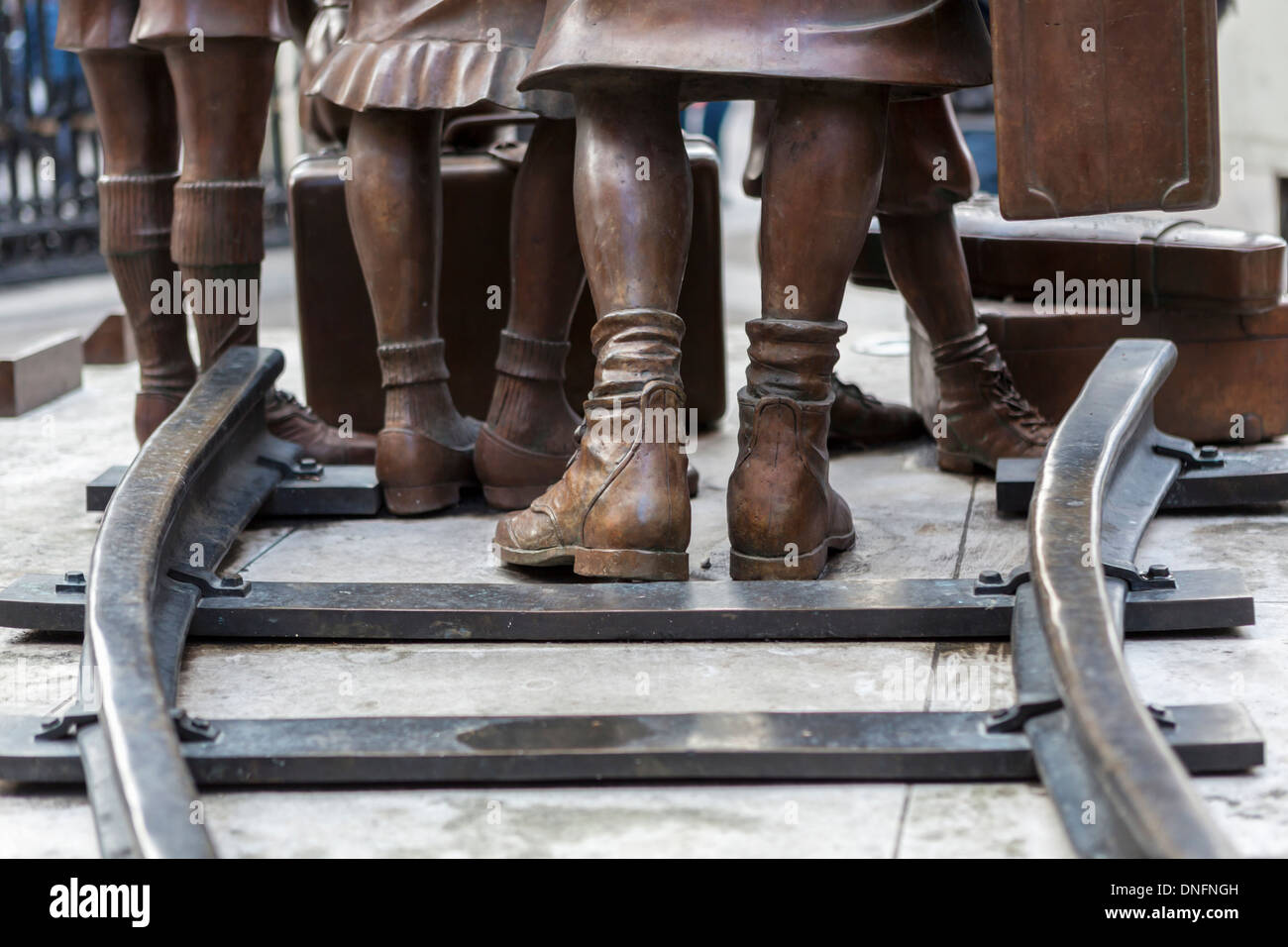 Feet and railway line of Bronze Kindertransport memorial (2006) by Frank Meisler -   Liverpool street Station, London Stock Photo