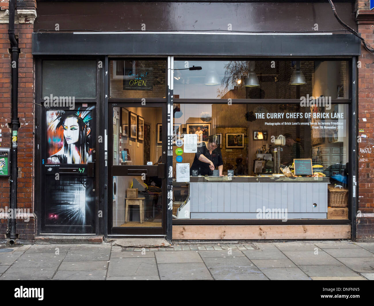 "The Curry Chefs of Brick Lane" and street art woman with black hair