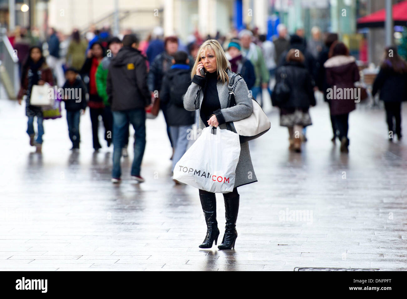 CARDIFF, WALES - December 26: Shoppers out looking for bargains in the Boxing Day sales on December 26, 2013 on Queen Street, Cardiff, Wales.  Credit:  Matthew Horwood/Alamy Live News Stock Photo