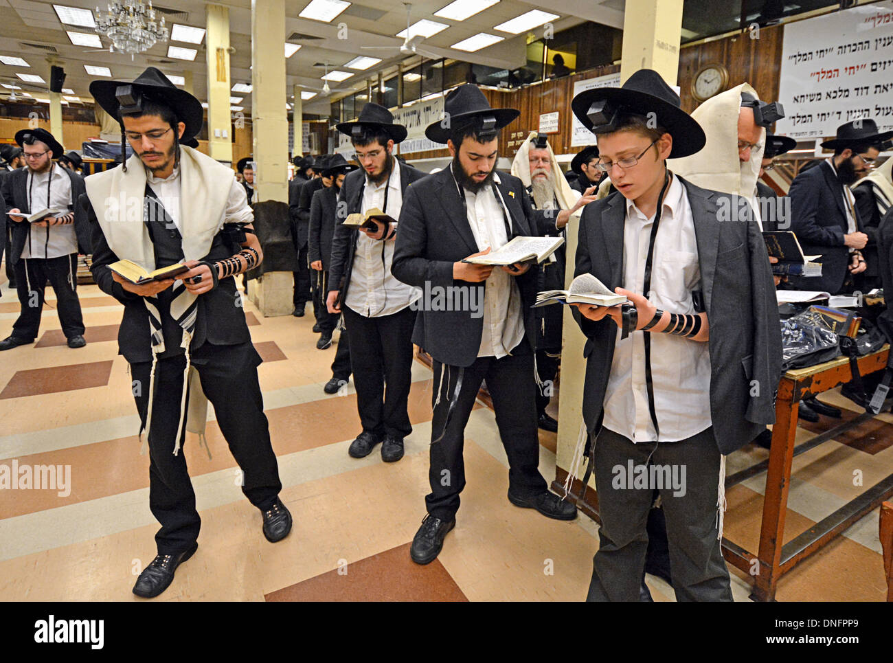 Orthodox Jewish men at weekday morning prayers wearing tefillin Stock