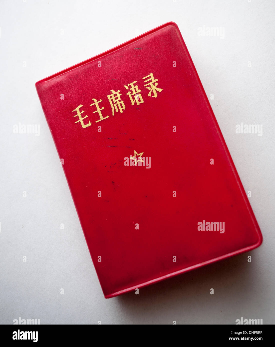 A vintage paperback copy of  Chairman Mao Zedong's 'Quotations from Chairman Mao Tse-tung', known as the 'Little Red Book is seen on his 120th birthday, Thursday, December 26, 2013.  The book was published from 1964 until 1976, popular during the Cultural Revolution and is one of the most printed books in history with 1,055,498,000 copies printed (according to official statistics supplied by the Chinese government). Credit:  Richard Levine/Alamy Live News Stock Photo