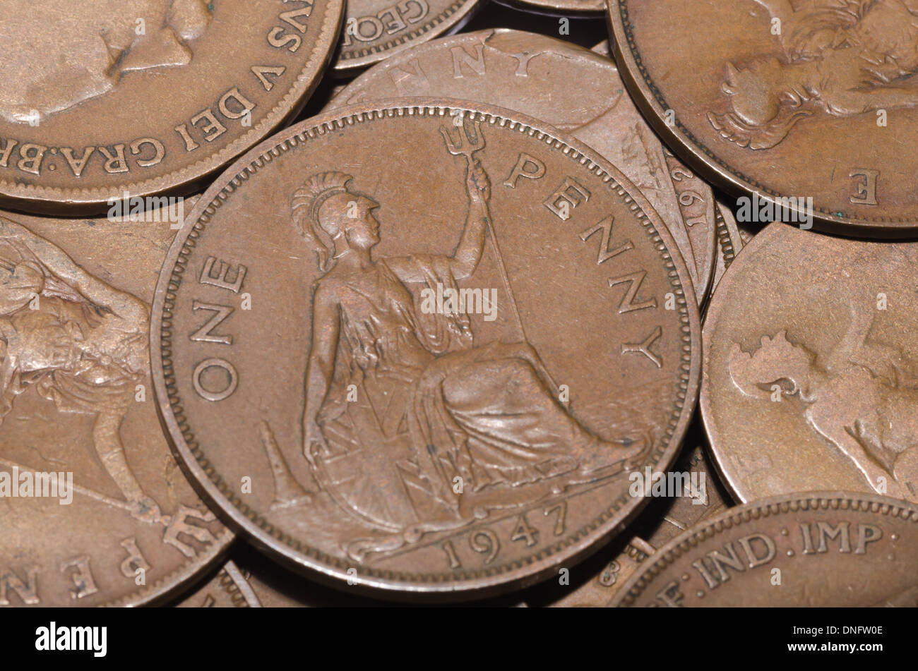 old currency uk penny 1d with King V and Queen Victoria worn