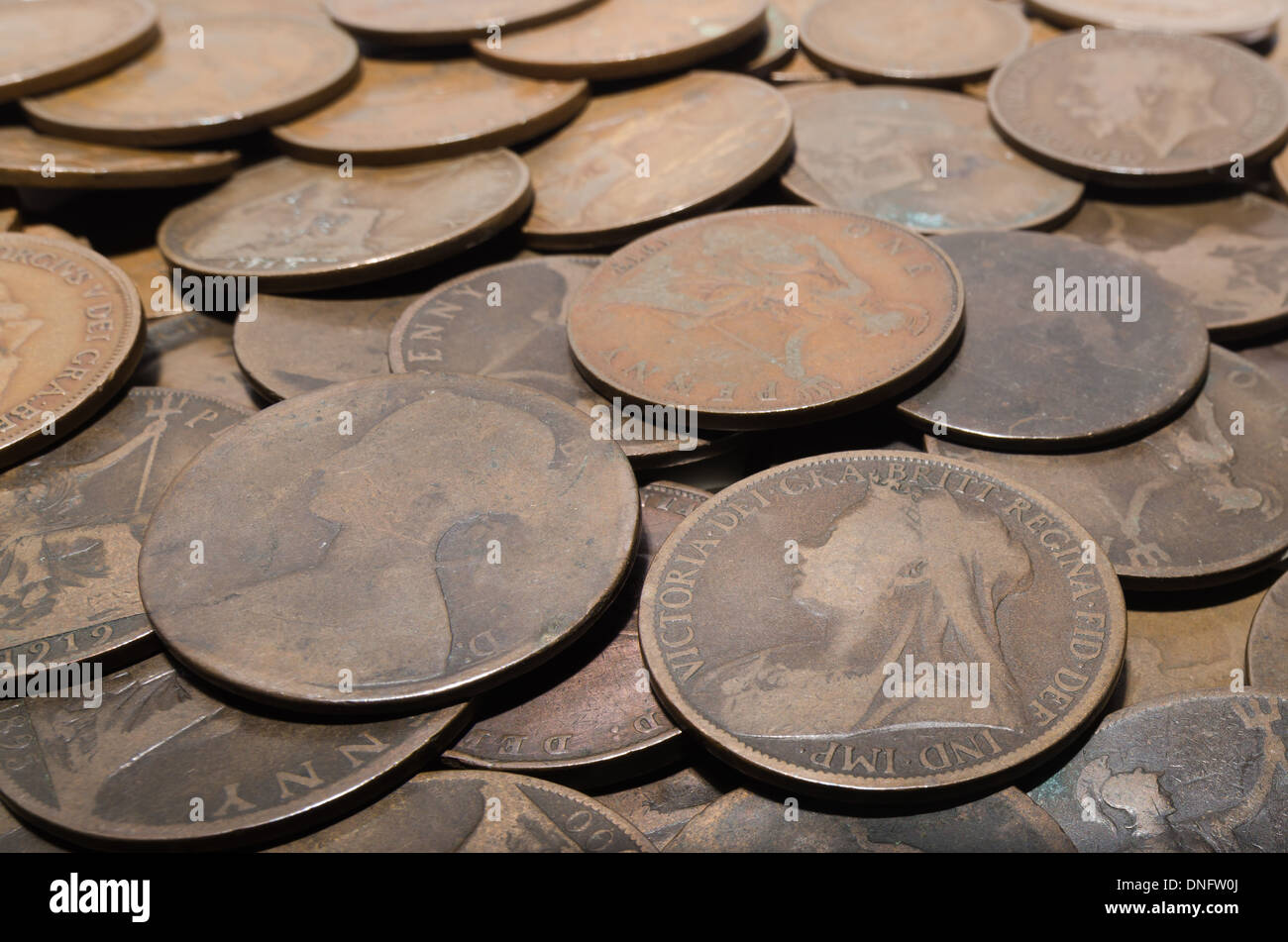 old currency uk penny 1d with King V and Queen Victoria worn