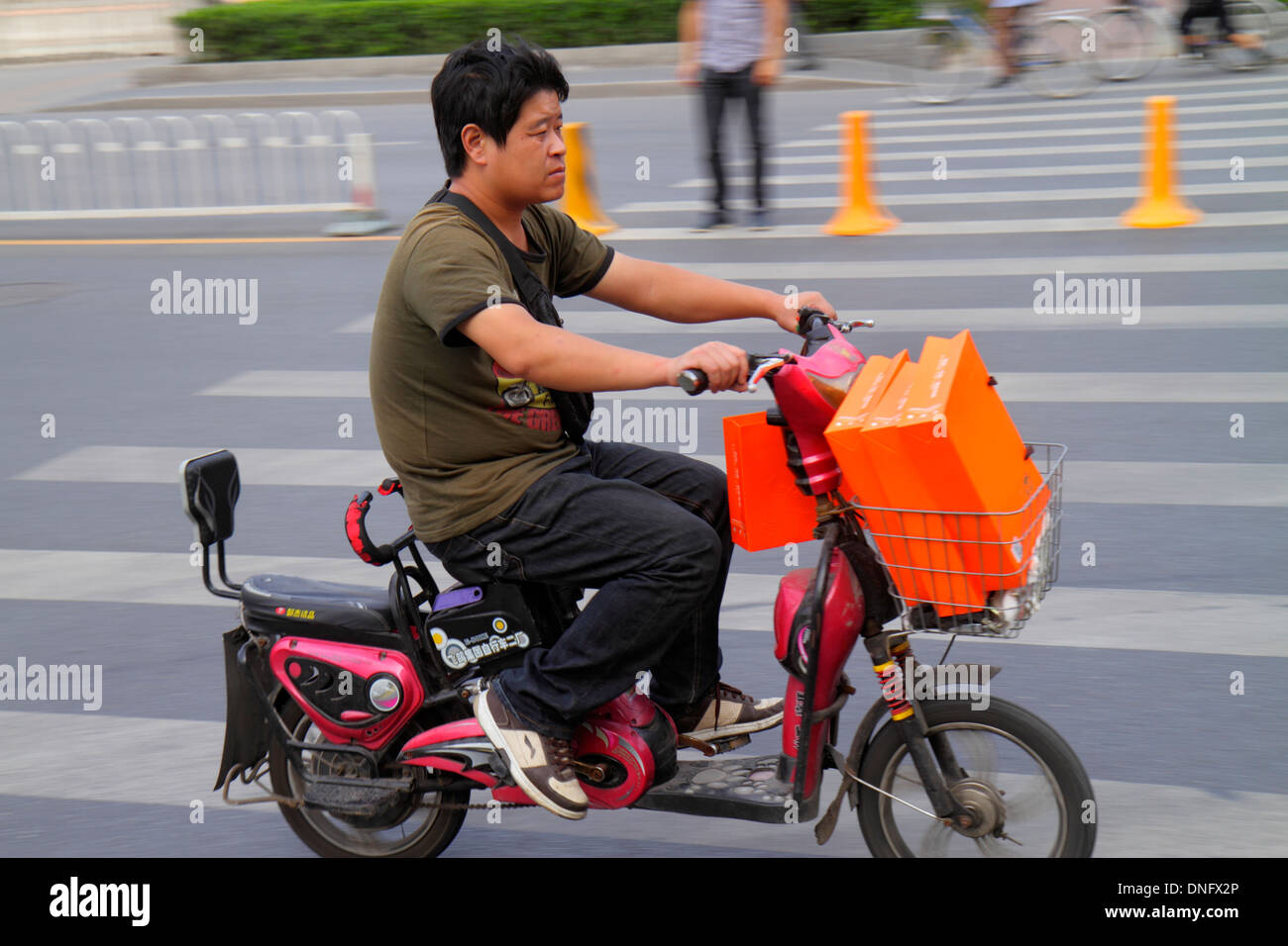 Beijing China,Asia,Chinese,Oriental,Guang An Men Nei Da Jie,Guanganmen Outer Street,Asian Asians,adult adults man men male,electric motor scooter scoo Stock Photo