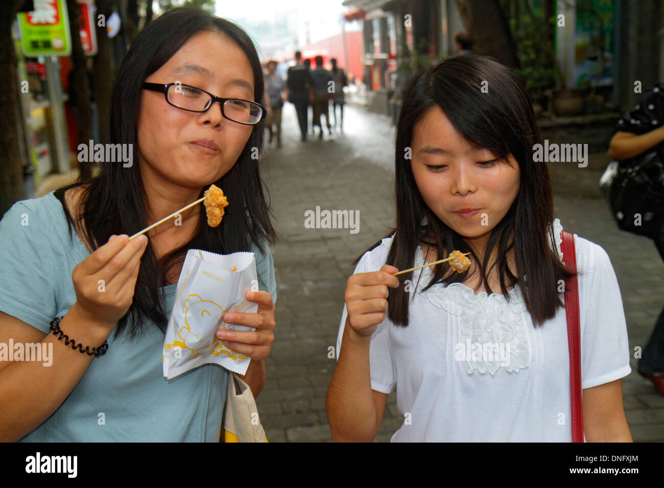 Beijing China,Chinese,Dongcheng District,Nanluoguxiang,hutong,Asian teen teens teenager teenagers girl girls,youngster,female kids children mother,adu Stock Photo