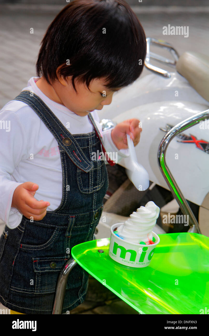 Beijing China,Asia,Chinese,Oriental,Dongcheng District,Nanluoguxiang,hutong,shopping shopper shoppers shop shops market markets marketplace buying sel Stock Photo