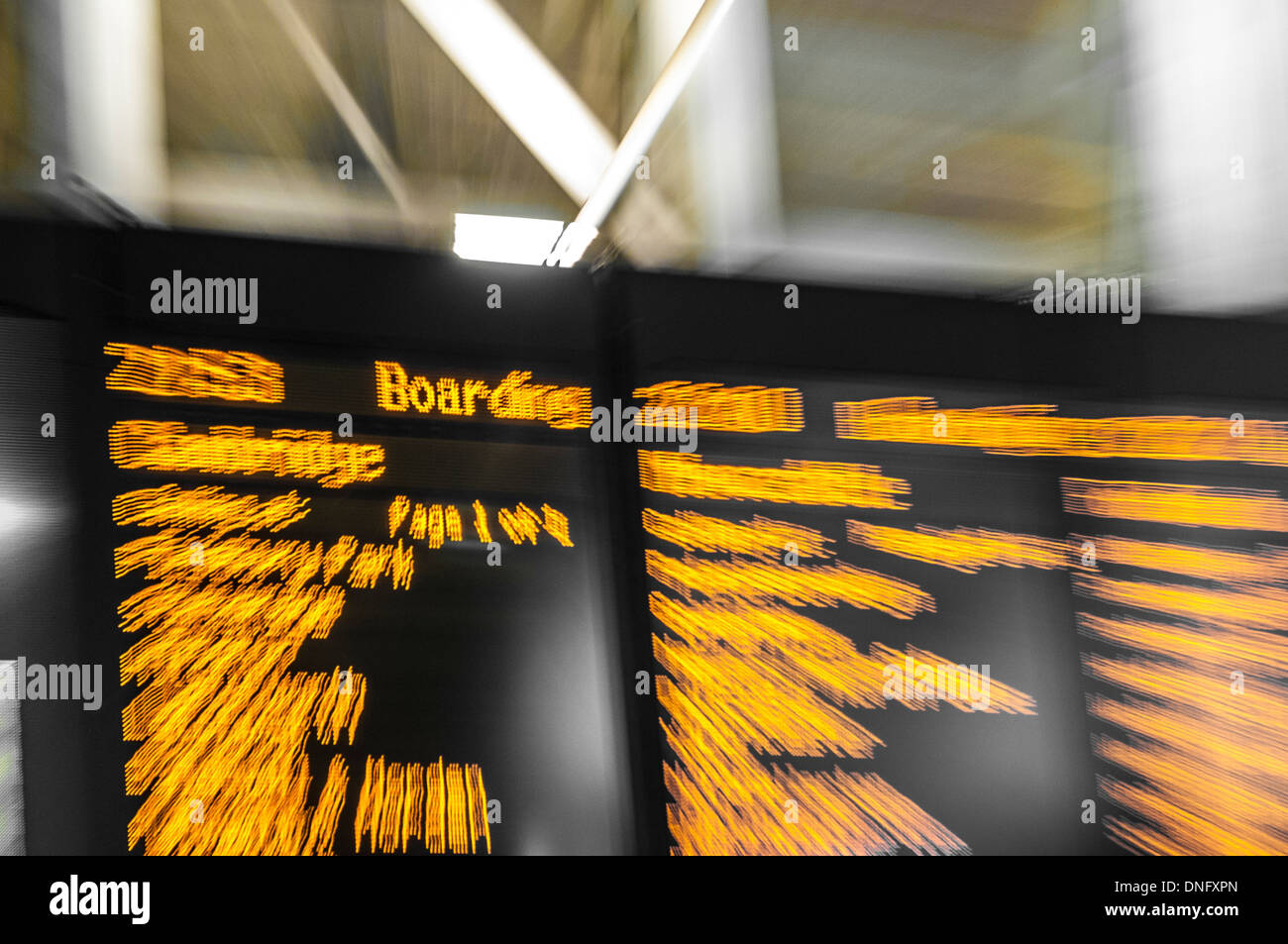 Illuminated sign at train station Stock Photo