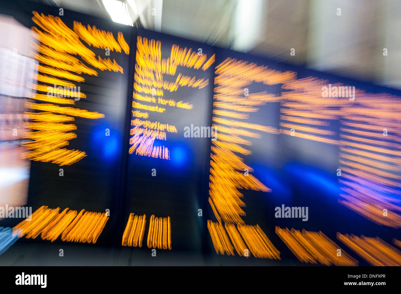 Illuminated sign at train station Stock Photo