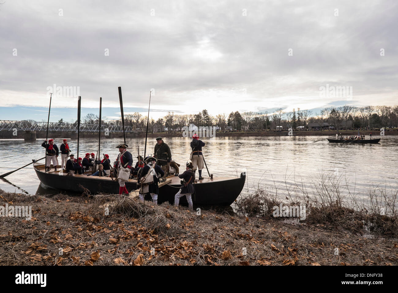 WASHINGTON CROSSING, NEW JERSEY - December 25, 2013: Soldiers land in New Jersey as part of a reenactment of Washington's crossing of the Delaware River.  Over 100 reenactors celebrated the 237th anniversary of the event. Credit:  Jeffrey Willey/Alamy Live News Stock Photo