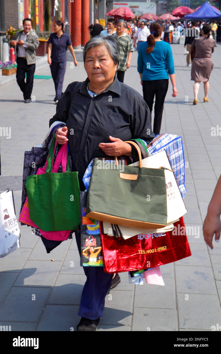 Asian Tourist Girl With A Louis Vuitton Shopping Bag On