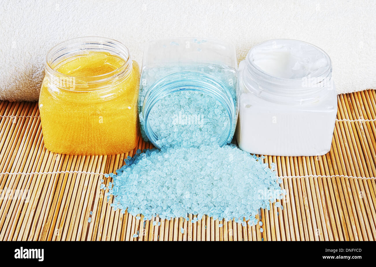 Natural spa cosmetics with bath salt,creams and towel Stock Photo