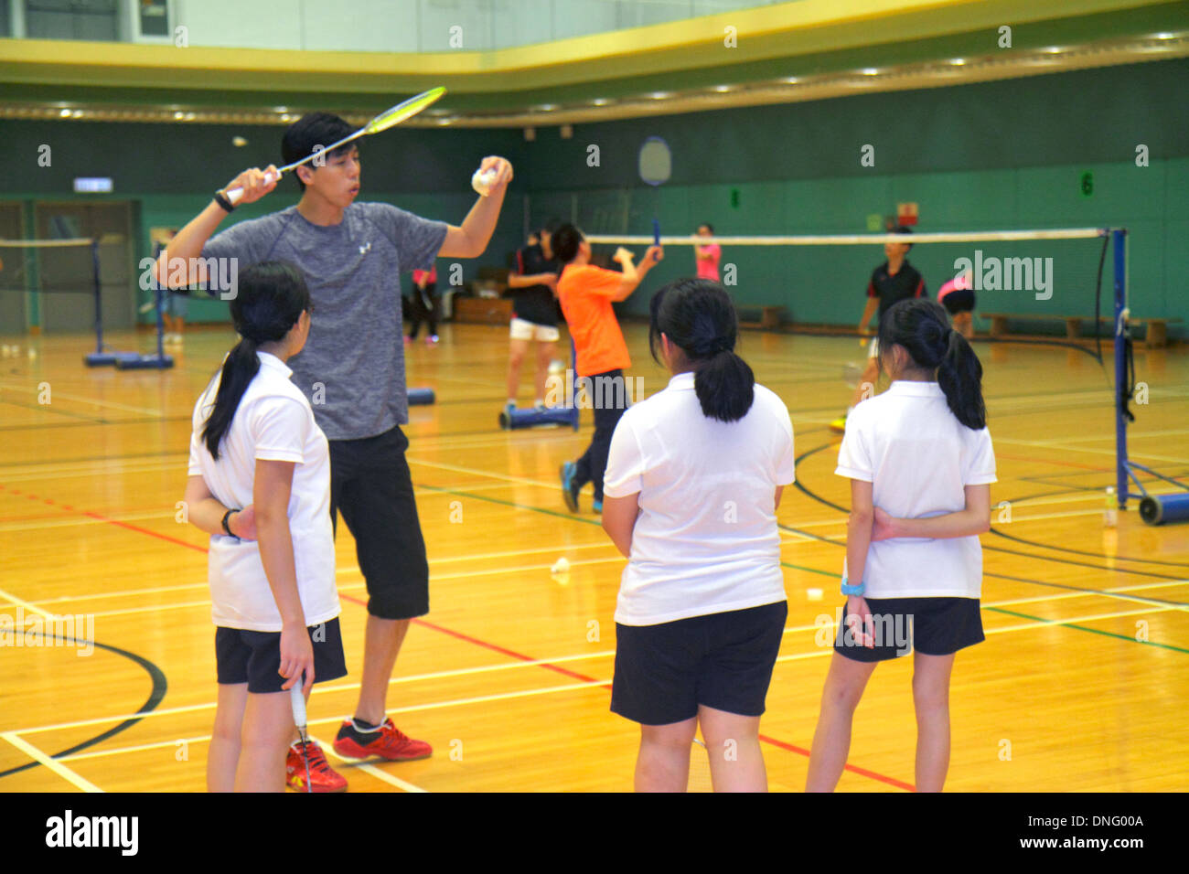 Hong Kong China,HK,Chinese,Island,Central,Hong Kong Park Sports Centre,center,badminton courts,indoor,gymnasium,Asian girl girls,youngster,female kids Stock Photo