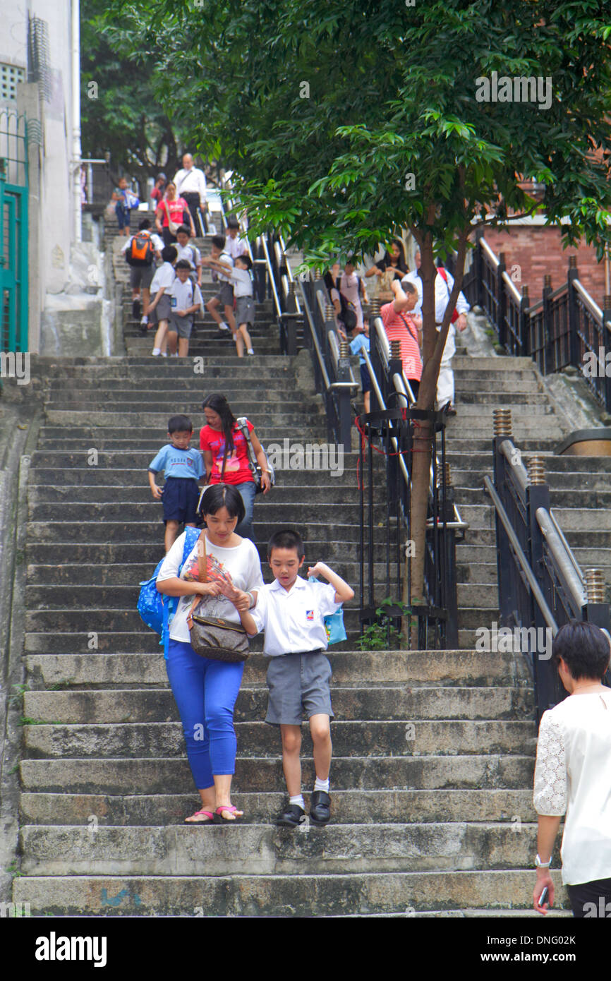 Hong Kong China,HK,Asia,Chinese,Oriental,Island,Sheung Wan,Mid Levels,Ladder Street,steps stairs staircase,Asian student students boy boys male girl,g Stock Photo