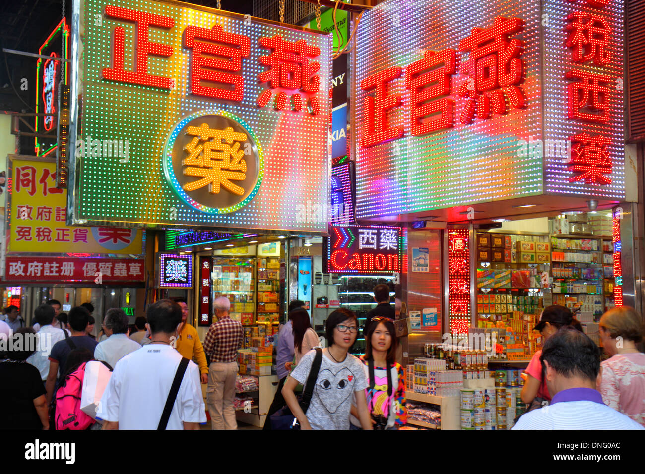 Hong Kong China,HK,Asia,Chinese,Oriental,Kowloon,Tsim Sha Tsui,Nathan Road,electric signs,camera store,shopping shopper shoppers shop shops market mar Stock Photo