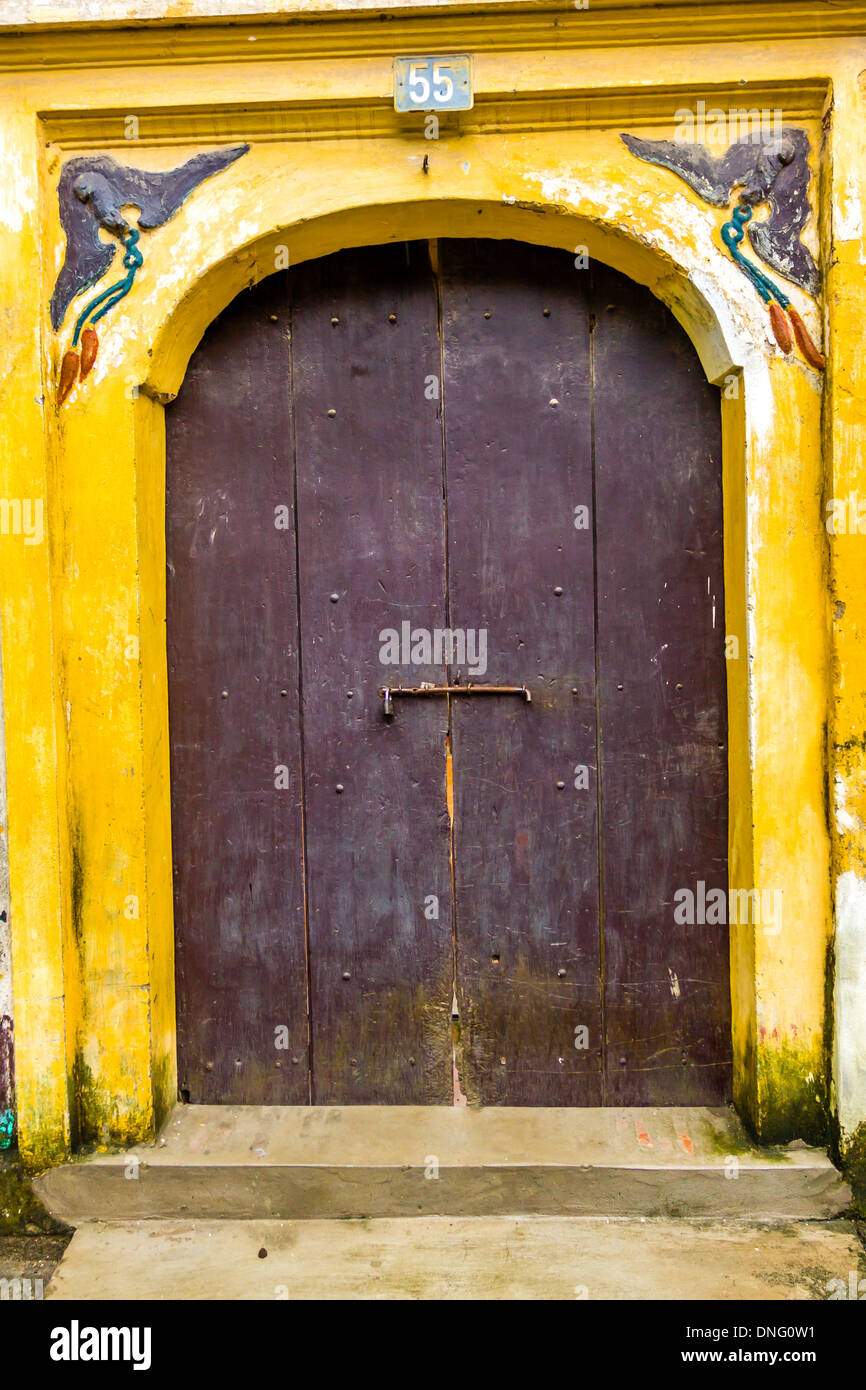 Wooden old door in Vietnamese temle Stock Photo