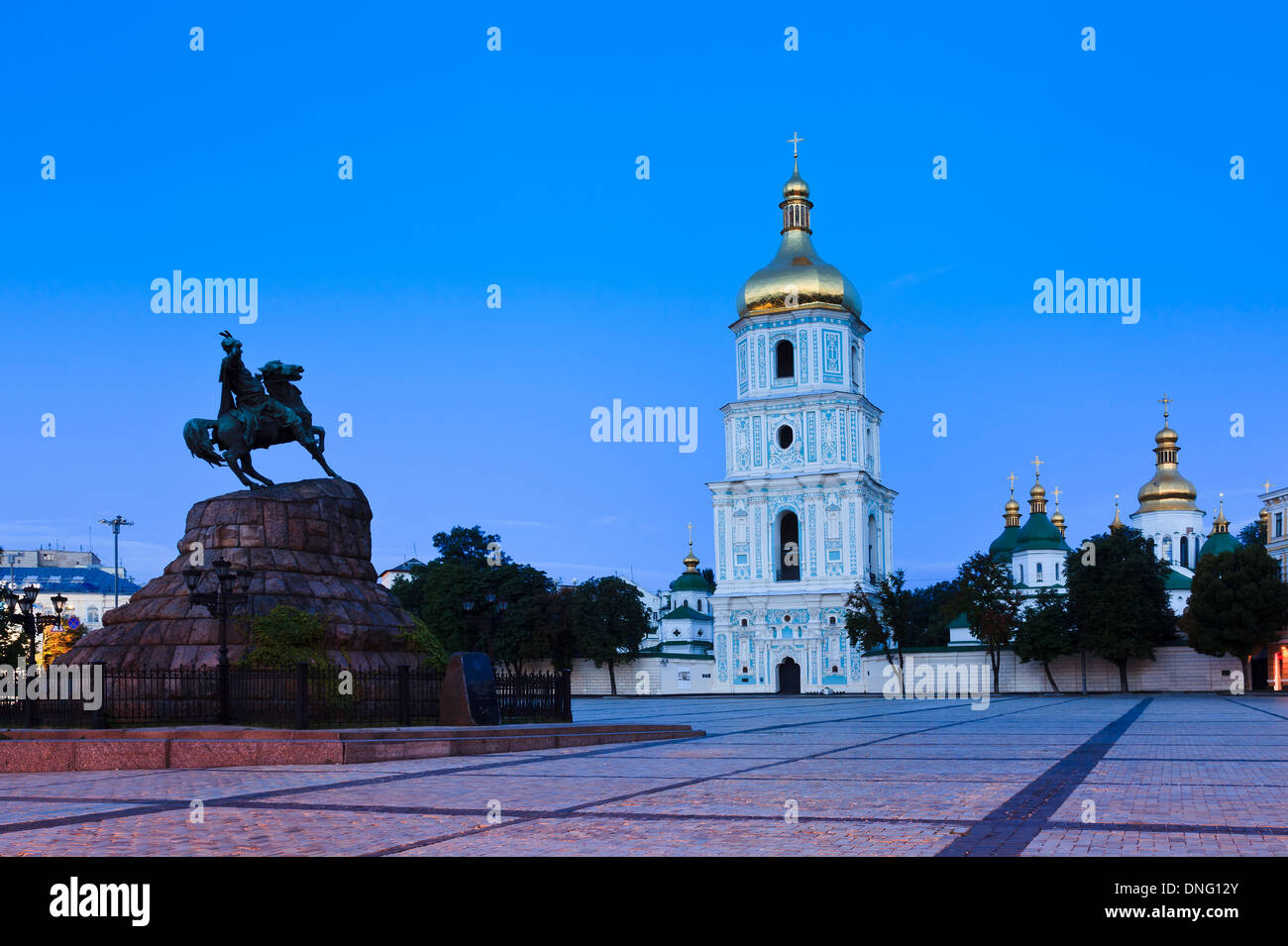 Ukraine Kiev St Sophia monastery complex and square with bell tower and Bohdan Khmelnitskiy monument at sunrise Stock Photo