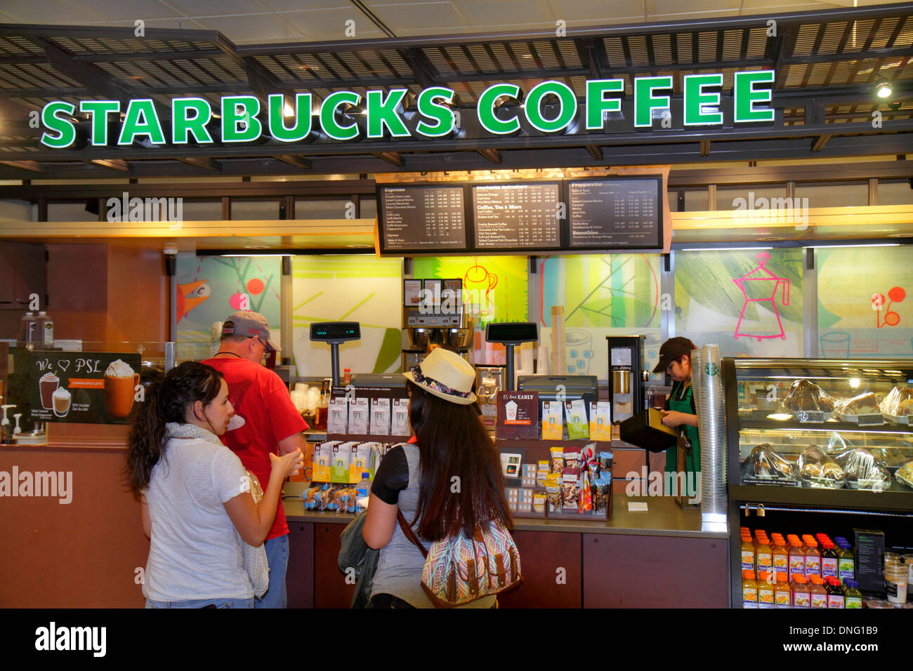 Texas,Houston,TX,Southwest,George Bush Intercontinental Airport,IAH,terminal,gate,Starbucks Coffee,barista,cafe,counter,customers,line,queue,adult,adu Stock Photo
