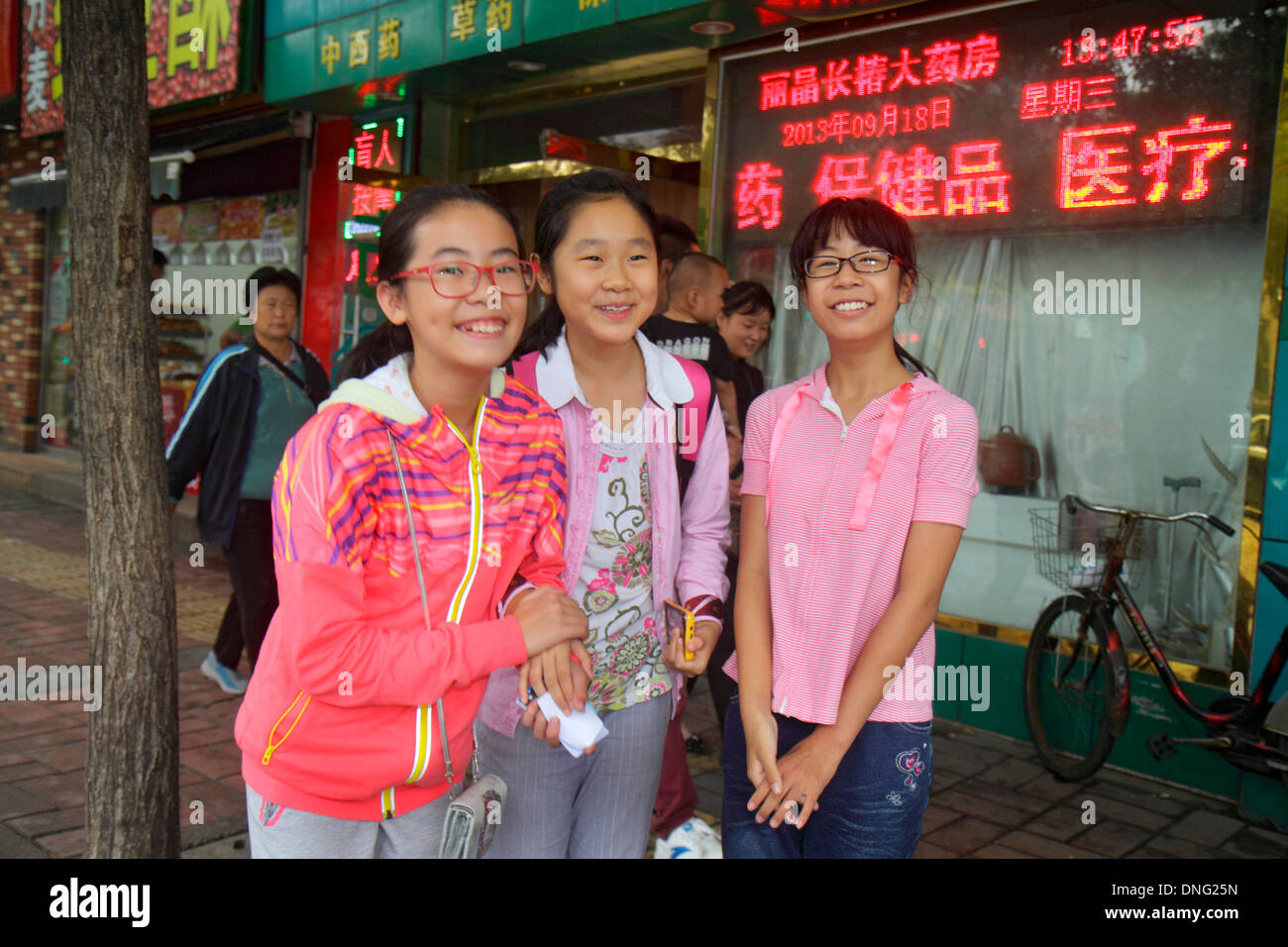 Beijing China,Asia,Chinese,Oriental,Xicheng,street,Asian Asians,teen teens teenage teenager teenagers youth adolescent,girl girls,youngster youngsters Stock Photo