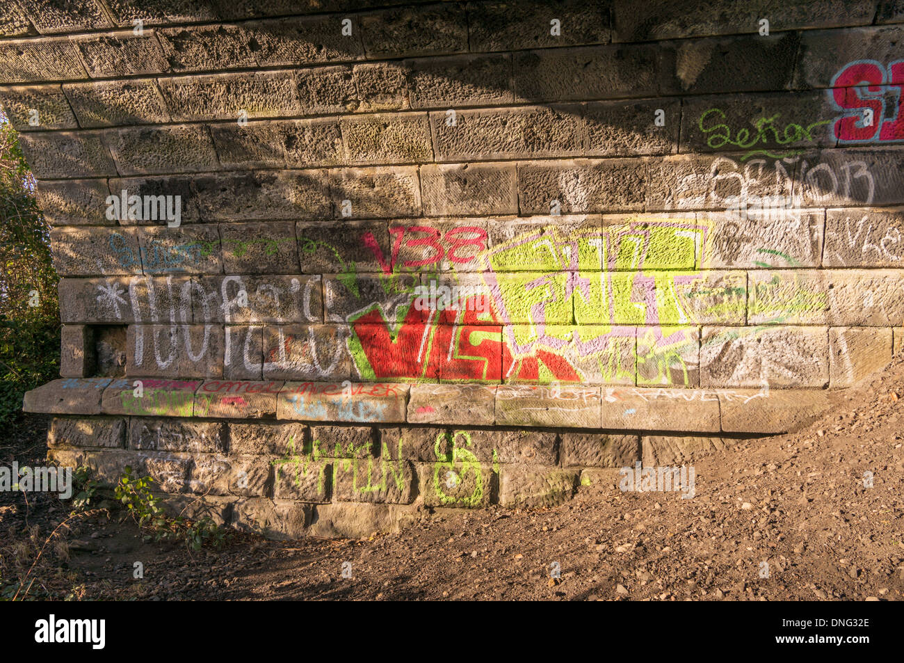 Graffiti within an arch of the Victoria viaduct or railway bridge Washington, north east England UK Stock Photo