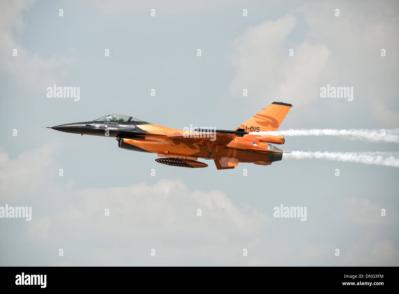 Lockheed Martin F-16 fighter jet of the Royal Netherlands Air Force demonstration team in it's orange livery arrives at the RIAT Stock Photo