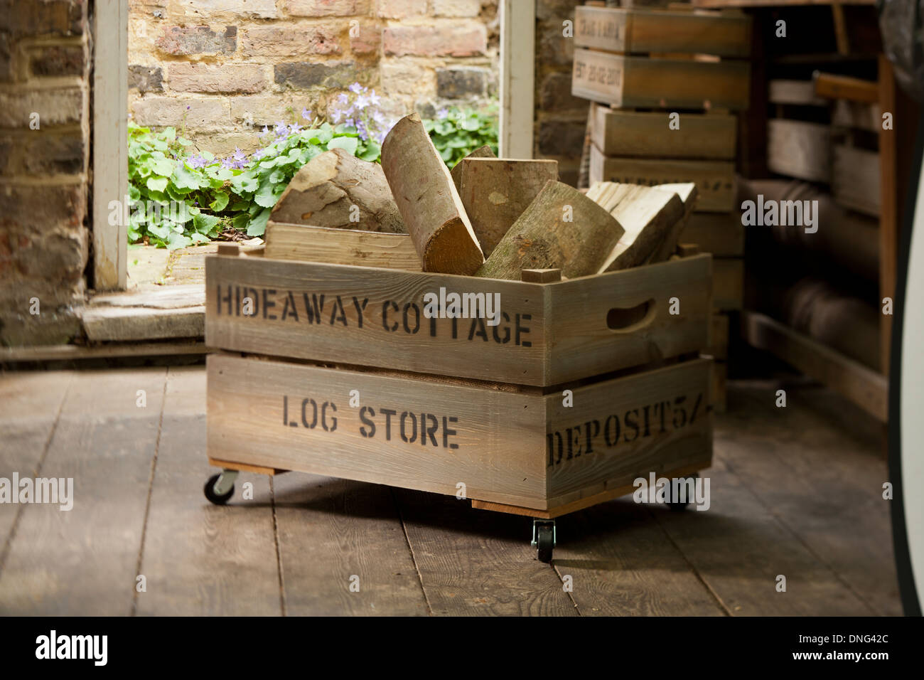 Split wooden logs in a storage box Stock Photo Alamy