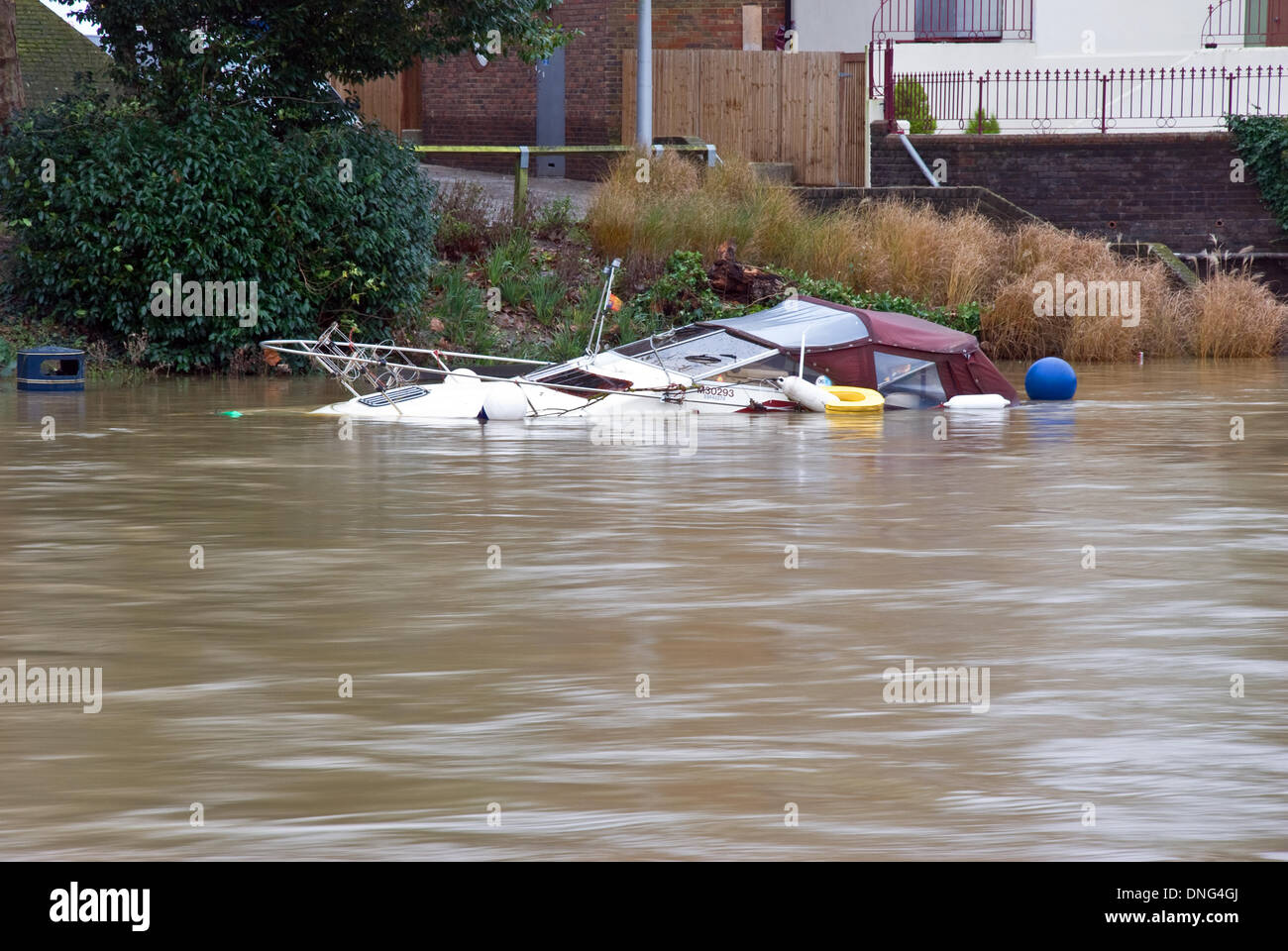 Floods cause boat to sink Stock Photo Alamy