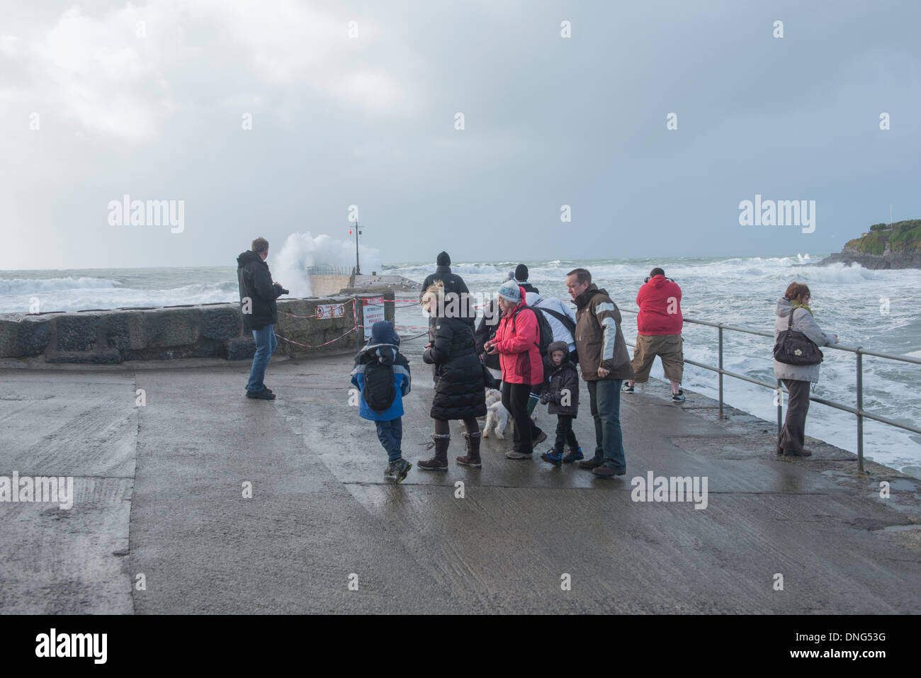 Porthleven, Cornwall . 27th Dec, 2013. Storm watchers watch the seas