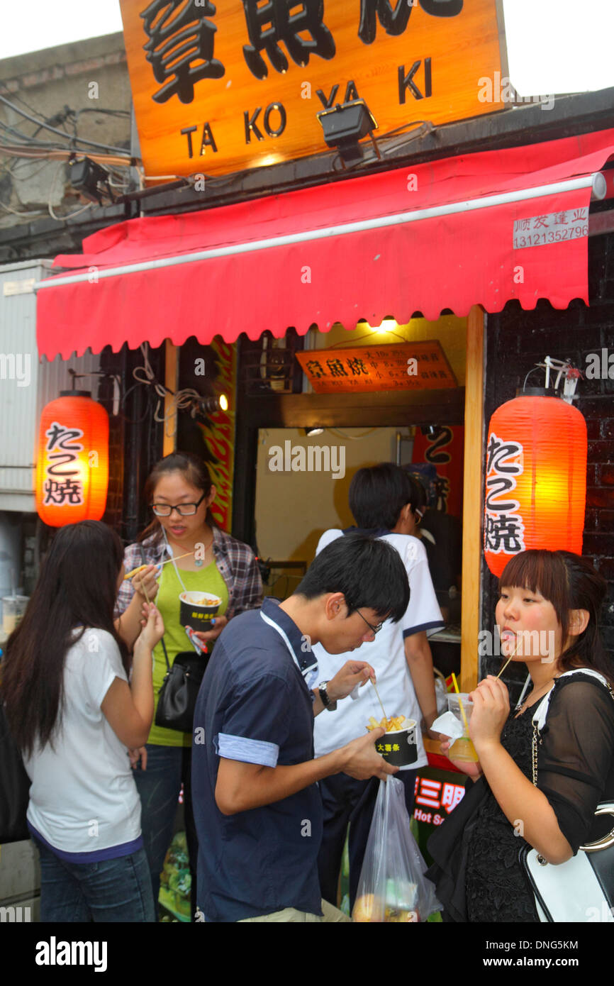 Beijing China,Chinese,Dongcheng District,Nanluoguxiang,hutong,shopping shoppers shop shops market buying selling,store stores business businesses,Asia Stock Photo