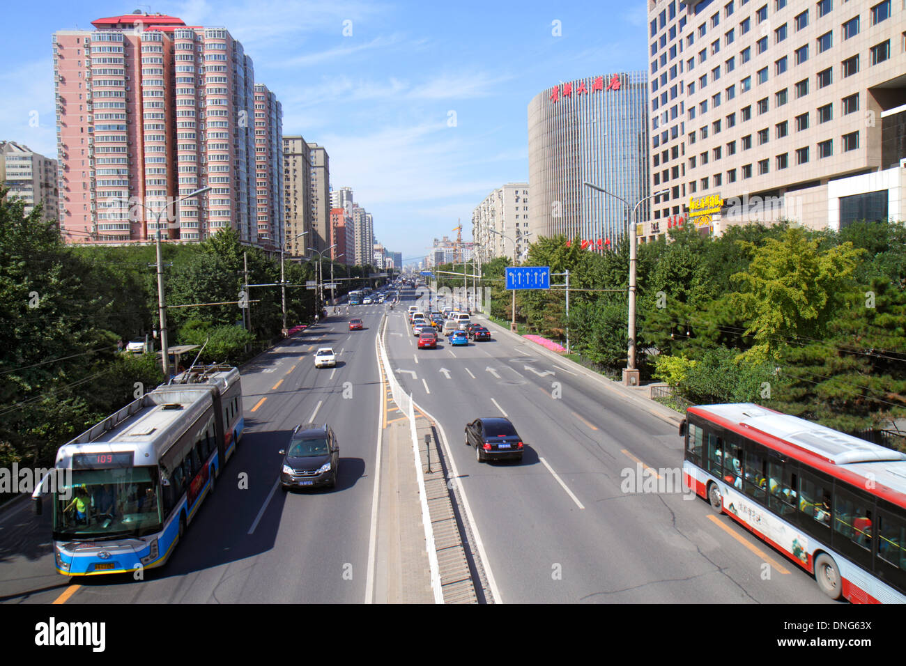 Beijing China,Chinese,Xicheng District,Guang An Men Nei Da Jie,Guanganmen Outer Street,traffic,bus,coach,high rise,condominium residential apartment a Stock Photo